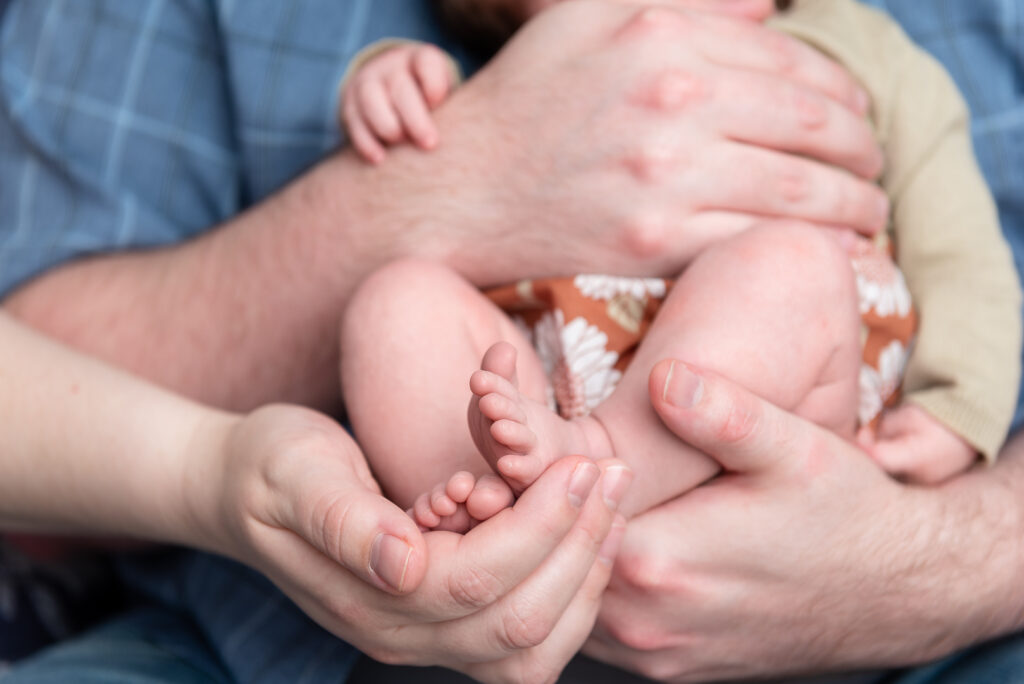 baby in parents hands