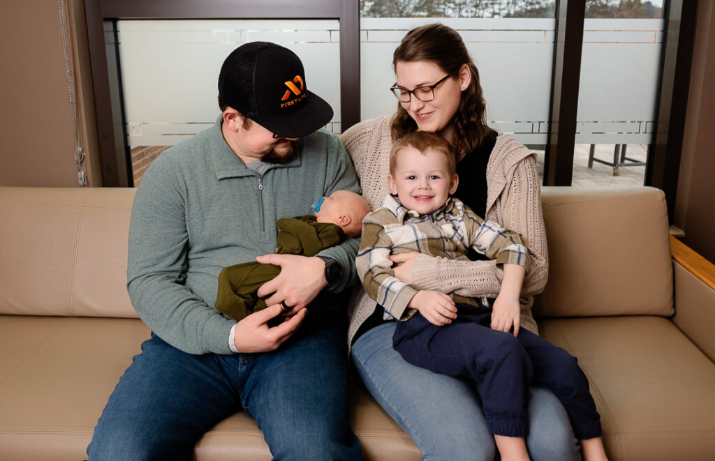 Minimalist newborn photography style with soft textures neutral colors and timeless posing