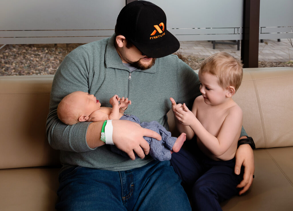 Newborn baby posed safely on soft beanbag setup by certified Wisconsin newborn photographer