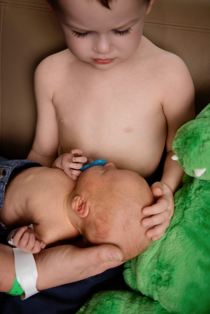 Baby yawning during natural newborn session photographed at The Croix Studio