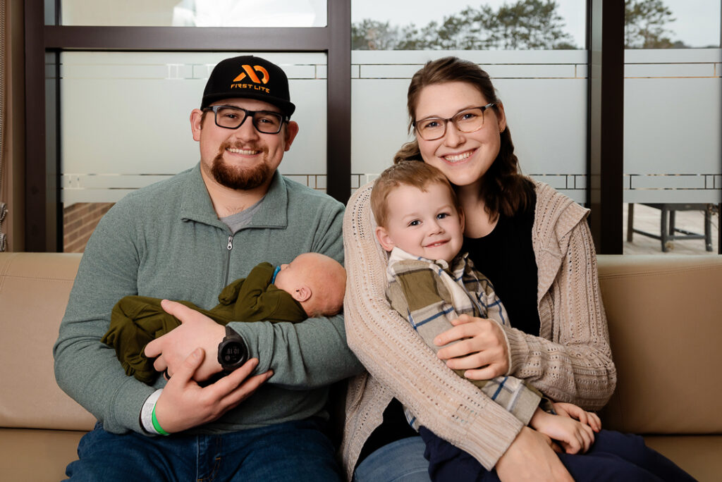 Soft and emotional motherhood photography highlighting connection between mom and newborn