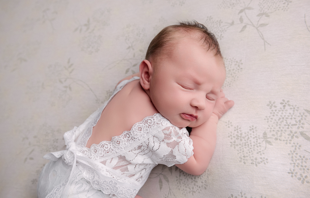 Close-up of newborn baby in natural position, minimalist and safe newborn photography New Richmond WI
