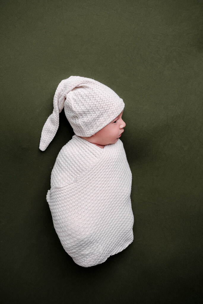 Soft natural tones and textures in newborn studio session, Wisconsin newborn photographer minimalist editing style.